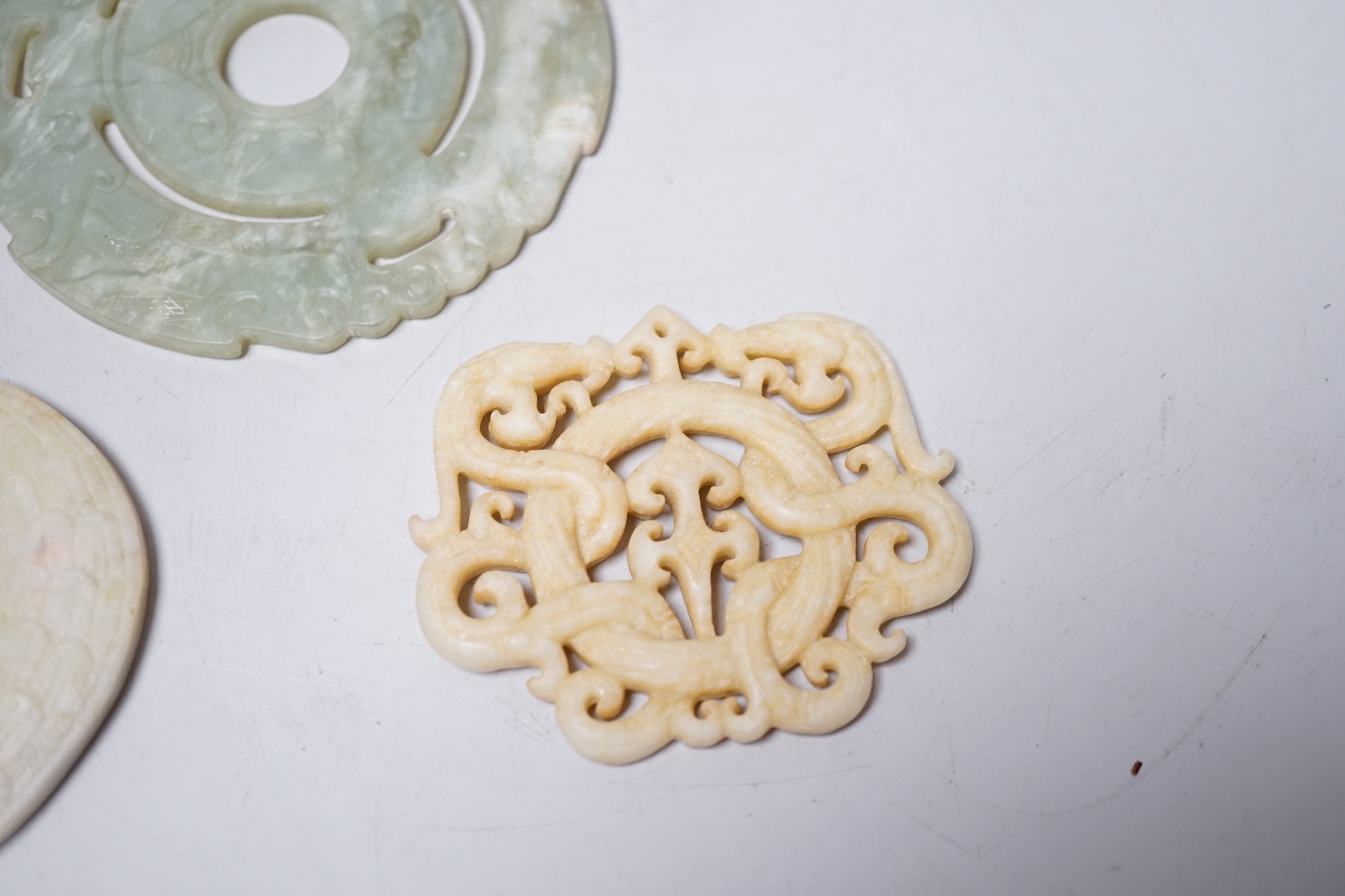 A Chinese bi disc and two other hardstone carvings